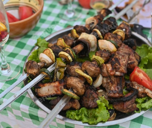 Preview: grilled meat with vegetable. Mixed grilled bbq meat with vegetables.