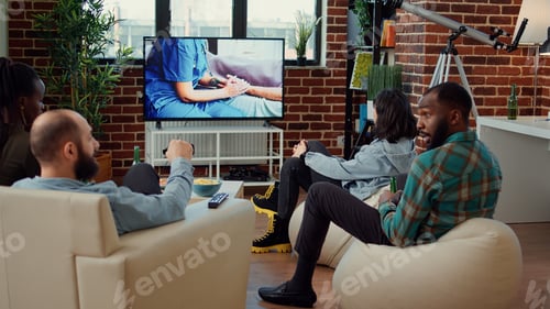 Preview: Multiethnic group of people watching drama tv series