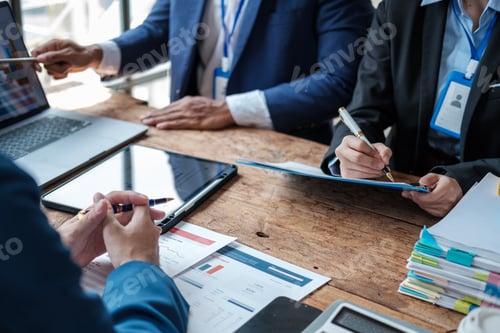 Preview: Business team analyzing income charts and graphs with modern laptop computer. Close up.Business anal