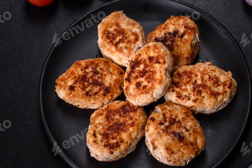 Preview: Delicious fresh fried minced meat patties on a dark concrete background