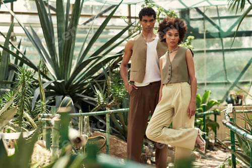 Preview: Young couple sharing a moment of love amidst lush greenery in a vibrant greenhouse