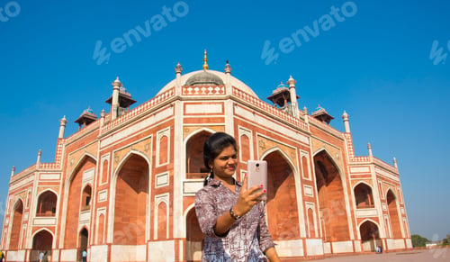 Preview: Young girl taking Photos in front of Humayun's Tomb, Delhi, India.