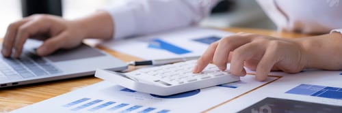 Preview: accounting concept, Businesswoman using a calculator with computer laptop, budget, and loan paper in
