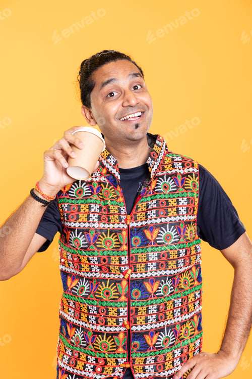 Preview: Jolly person drinking hot beverage, having positive facial expression