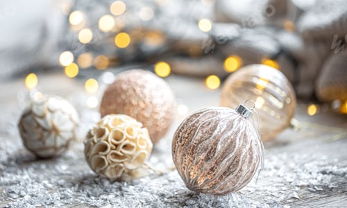 Preview: Festive background with Christmas balls and blurred bokeh lights.