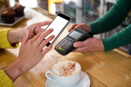 Preview: Barista accepting payment through smart phone