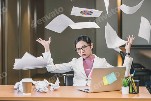 Preview: Asian businesswoman angry throwing papers over the herself in office when job fail,