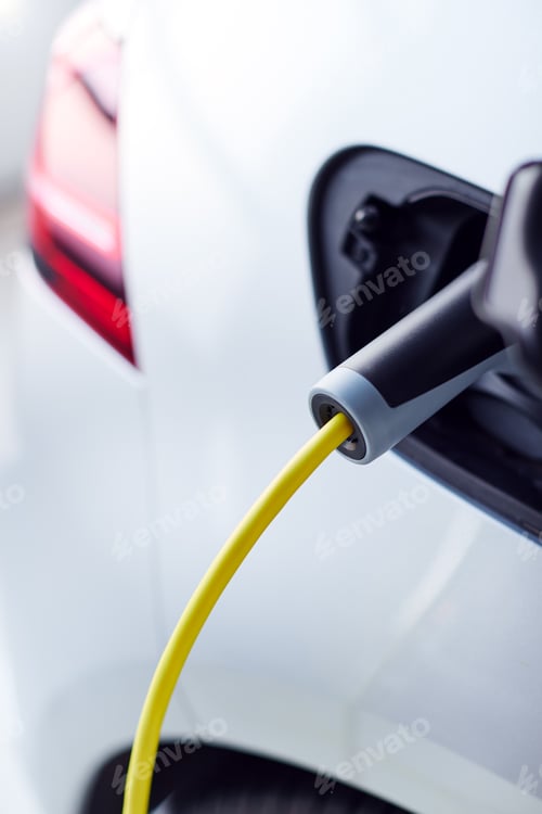 Preview: Close Up Of Power Cable Charging Environmentally Friendly Zero Emission Electric Car In Garage