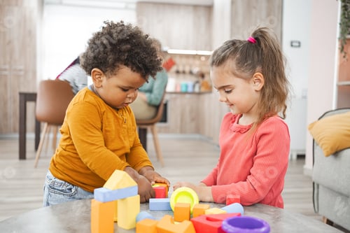 Preview: Two Children Play Together with Colorful Building Blocks