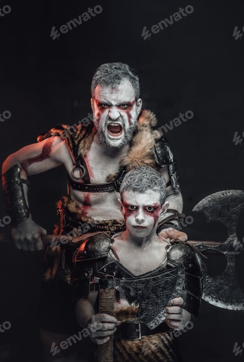 Preview: Screaming warrior poses with his son in dark background