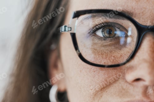 Preview: Half face, eyes and woman with glasses for optical healthcare, prescription or perception. Female,