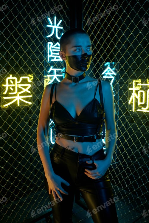 Preview: Serious cyberpunk girl in black leather pants and tanktop