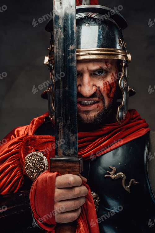 Preview: Mad warrior from rome staring at camera holding sword