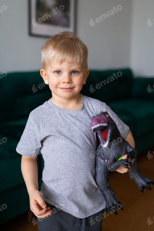Preview: portrait of boy playing big dinosaur toy