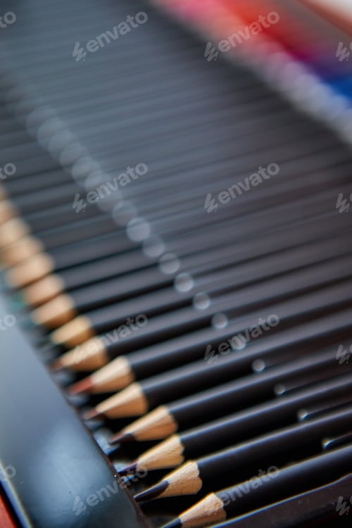 Preview: Selective focus shot of a row of professional colored pencils