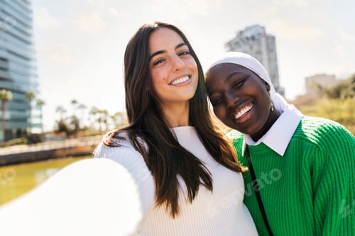 Preview: selfie of two young women friends smiling happy