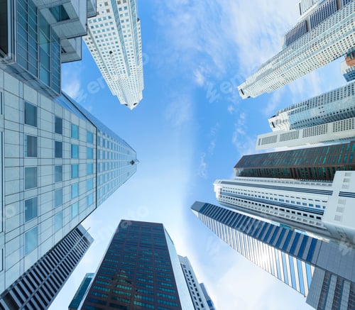 Preview: Business buildings view from look up with blue sky and cloud.
