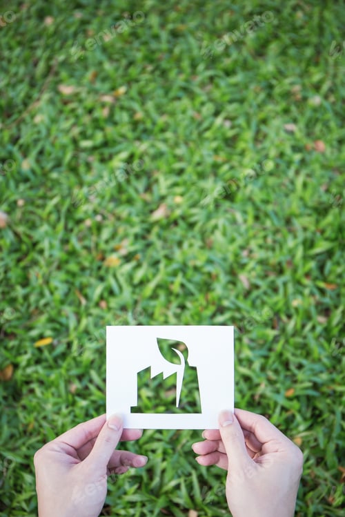 Preview: Hands holding cut paper with the logo of factory industry shape