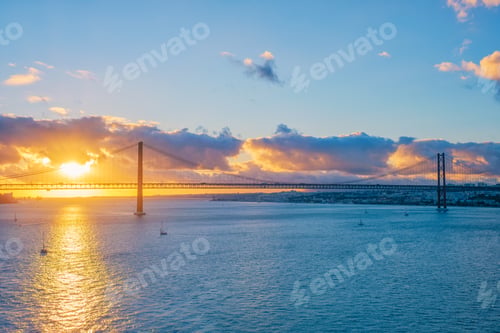 Preview: View of 25 de Abril Bridge over Tagus river on sunset. Lisbon, Portugal