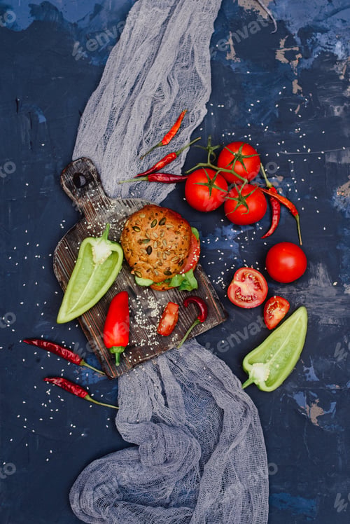 Preview: Delicious grilled hamburgers with beef, tomatoes, peppers, cucumbers and lettuce. Top view