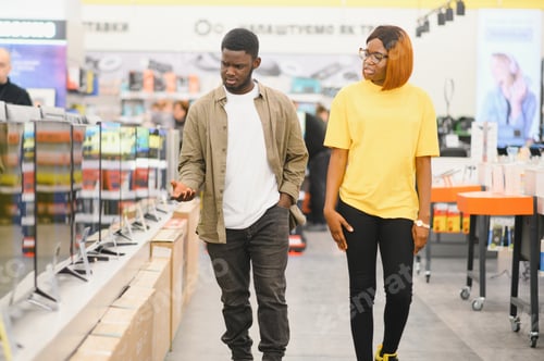 Preview: African american Couple buying television at store