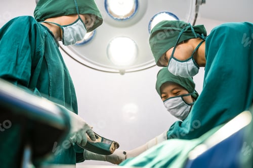 Preview: Surgeons Working Together in Bright Operating Room