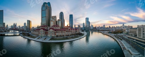 Preview: Aerial shot of an urban skyline with landmarks along the Haihe River in Tianjin, China at sunset