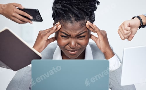 Preview: Im about to break. Shot of a young businesswoman looking stressed out.
