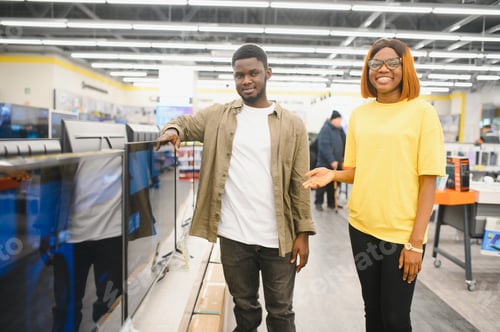 Preview: African american Couple looking for new TV to buy. New technologies concept.