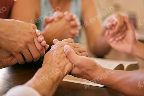 Preview: Shot of a group of people holding hands in prayer