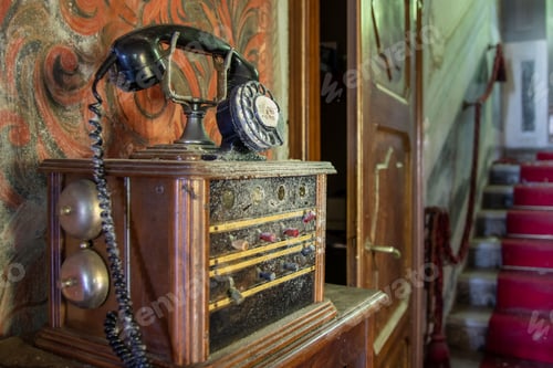 Preview: Closeup shot of a dusty vintage antique phone in an abandoned home