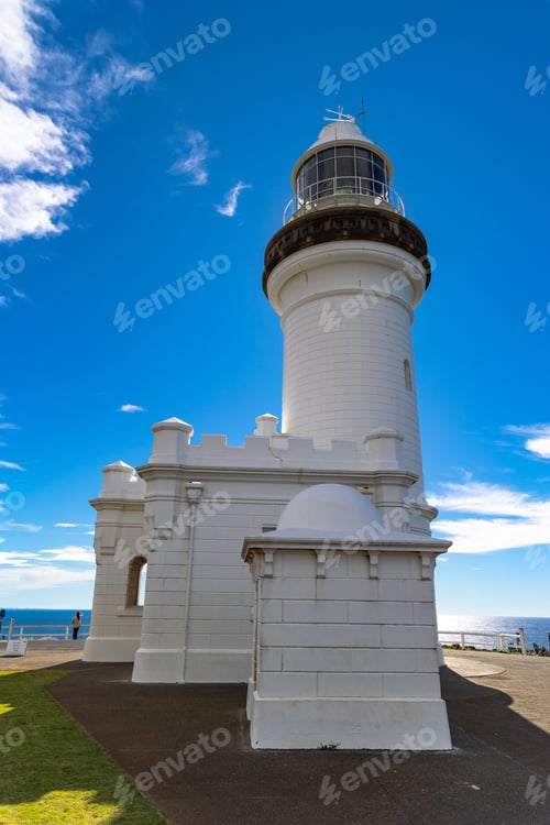 Preview: White lighthouse against clear blue sky