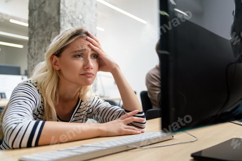 Preview: Exhausted female worker sit at office desk feel unwell having dizziness, tired woman employee
