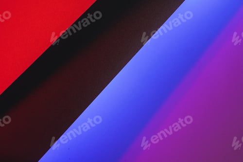 Preview: Colored paper cards in neon light close up