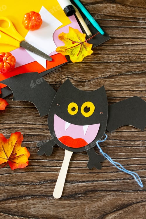 Preview: Dracola bat toy Halloween on a wooden table.