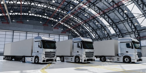 Preview: 3D modern trucks parked in spacious warehouse