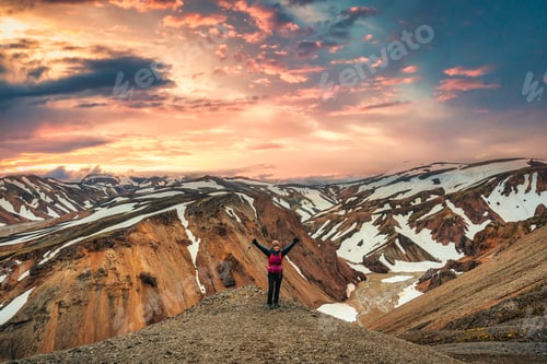 Preview: Hiker woman standing on the peak with volcanic mountain range with snow covered on Blanhjukur trail