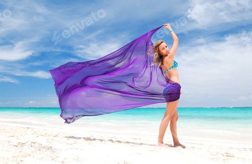 Vista previa: Woman With Sarong On Caribbean Beach