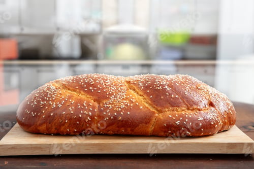 Preview: Easter sweet bread, homemade tsoureki braid on a wooden board, closeup