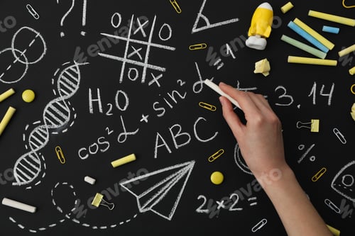 Preview: School formulas and drawings on a black school board