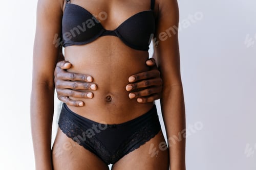 Preview: Shirtless black man touching his girl's tummy