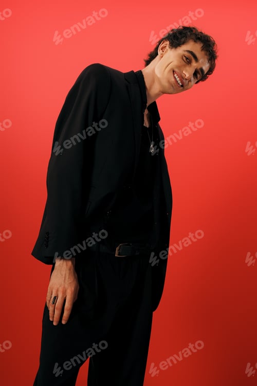 Preview: Stylish man in elegant attire showcases charisma against a vibrant backdrop