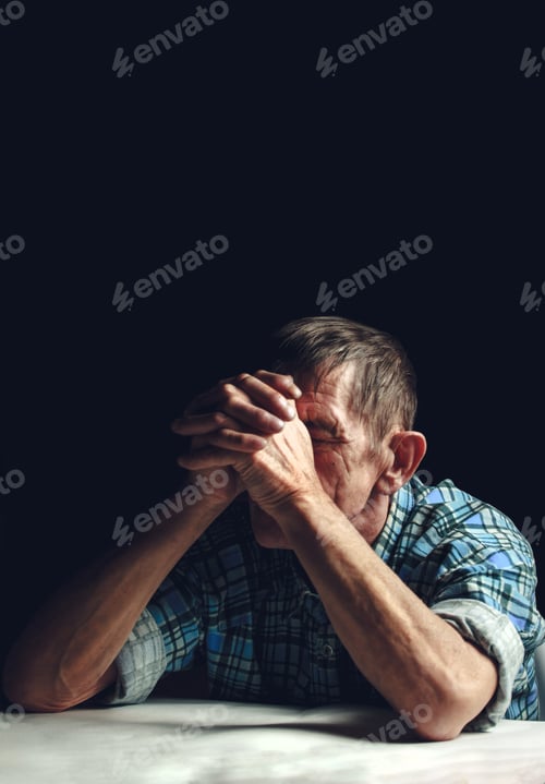 Preview: Depressed senior covers his face with his hands. Alzheimer's disease concept.