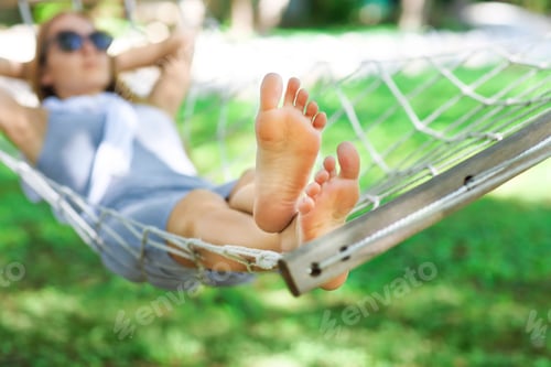Preview: Relaxing Time: Bare Feet in a Hammock Outdoors