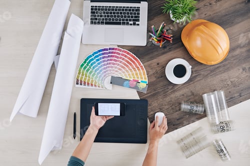 Preview: Interior designer checking house blueprint