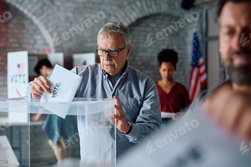 Preview: Senior American citizen voting at polling place.