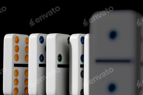Preview: Dominoes standing in a row on black background