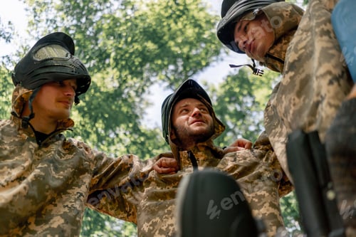 Preview: low shot in the forest in the middle of the field pinball players in uniform team hugging positive