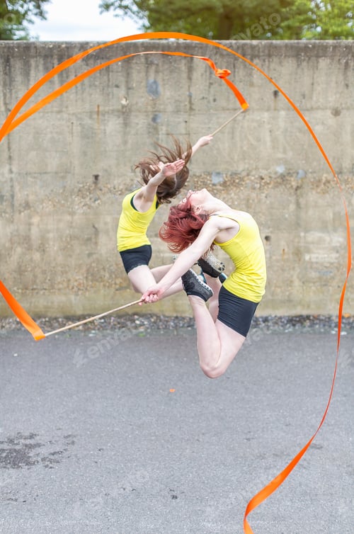 Preview: Young women practising ribbon dance on court