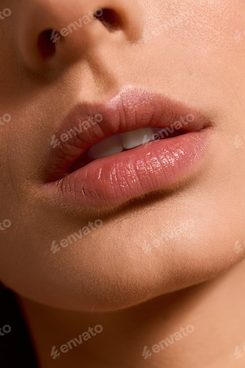 Preview: Elegant young woman showcasing natural beauty and allure in a chic setting with soft lighting
